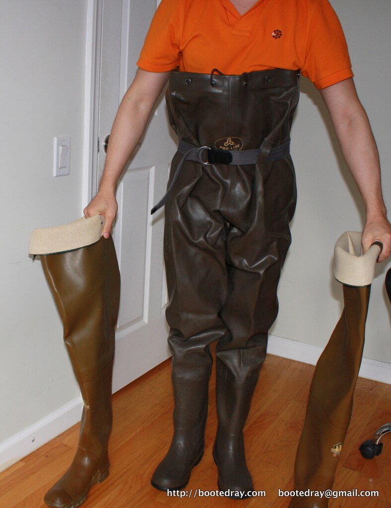 chest waders on hands